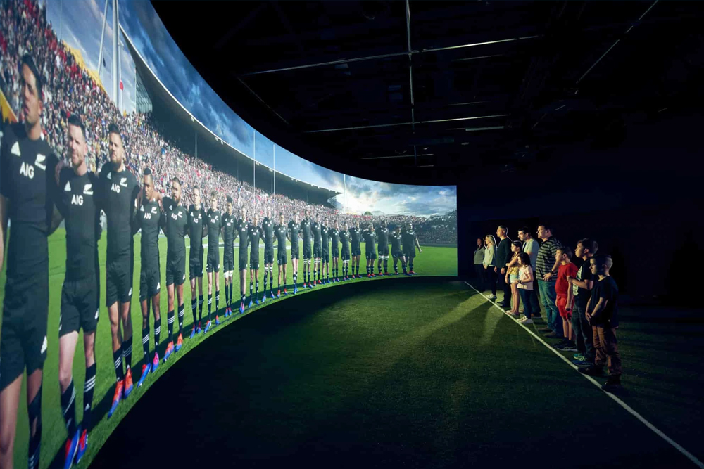 All Blacks Experience - Immerse yourself in the All Blacks Experience, a state-of-the-art interactive journey celebrating New Zealand's rugby heritage. Feel the passion, witness the haka, and test your skills against legends. Discover stories of iconic players and moments through cutting-edge technology. Perfect for rugby fans and curious visitors alike. All Blacks Experience - Image 1 of 5