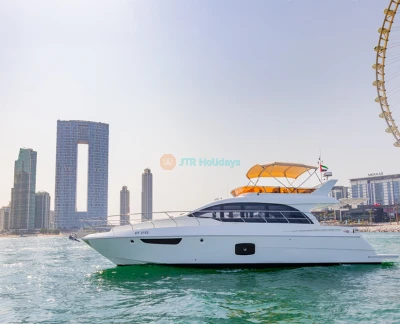 Fin Yacht Rental Dubai - 52 FT - Experience luxury on the water with Fin Yacht Rental Dubai – 52 FT. This private yacht offers an unforgettable cruise along Dubai's beautiful coastline, with stunning views of iconic landmarks like the Burj Al Arab and Atlantis The Palm. Ideal for small groups or special celebrations, the yacht features spacious decks, modern amenities, and a professional crew to ensure a memorable experience on the water. Fin Yacht Rental Dubai - 52 FT - Image 2 of 5