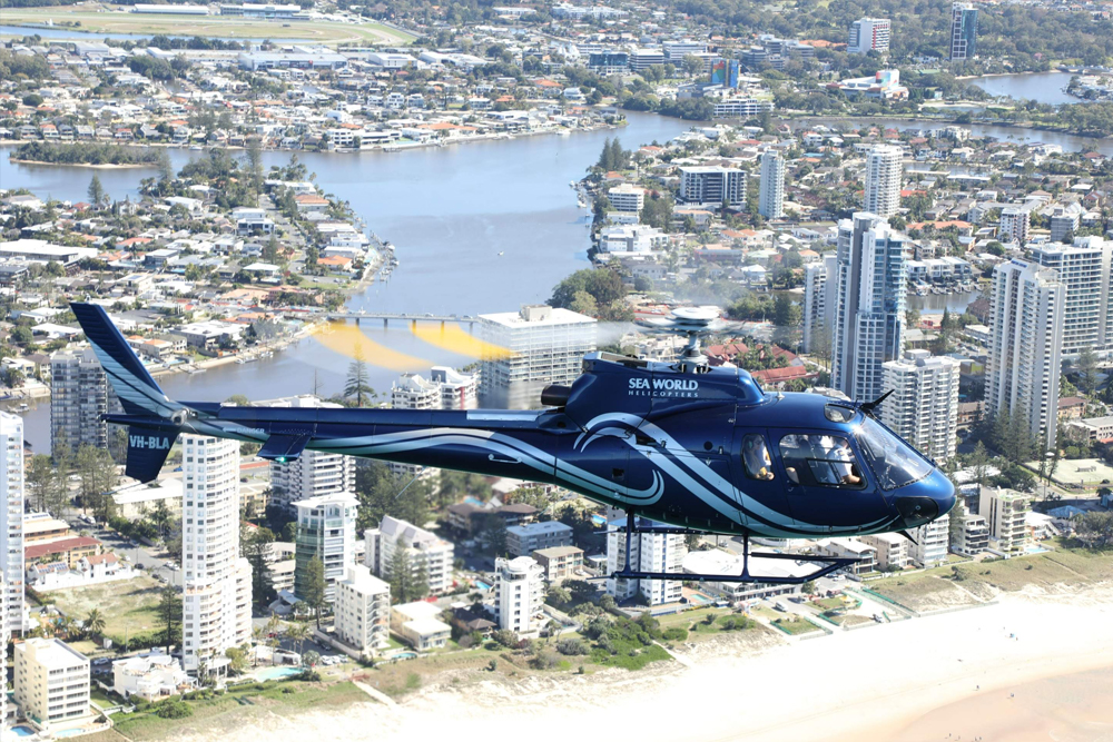Gold Coast Helicopter Flight - Experience the excitement of a Gold Coast Helicopter Flight as you soar above the stunning coastline, golden beaches, and iconic landmarks. Enjoy breathtaking aerial views of the Broadwater, lush hinterland, and Southern Gold Coast on this unforgettable adventure. Whether you're capturing photos or simply taking in the scenery, this scenic flight offers a unique way to explore the beauty of the Gold Coast from the sky. Gold Coast Helicopter Flight - Image 5 of 5
