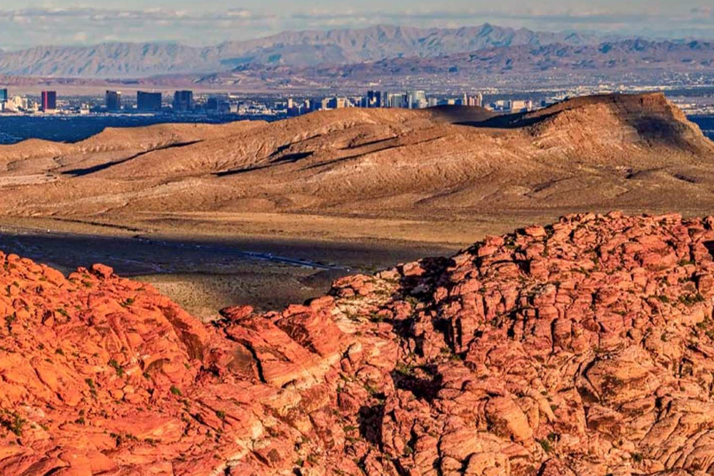 Las Vegas Red Rock Canyon Sunset Helicopter Tour - Experience the beauty of the Las Vegas desert with the Las Vegas Red Rock Canyon Sunset Helicopter Tour. Enjoy breathtaking aerial views of Red Rock Canyon, land at a private scenic viewpoint for a sunset champagne toast, and end your journey with a sparkling night flight over the Las Vegas Strip. Las Vegas Red Rock Canyon Sunset Helicopter Tour - Image 4 of 5