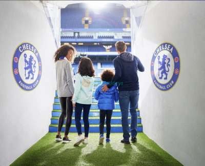 Chelsea FC Stadium & Museum Tour - Step into the world of Chelsea Football Club with an unforgettable tour of Stamford Bridge Stadium and its interactive museum. Explore the home dressing rooms, press room, players’ tunnel, and pitchside areas guided by passionate tour hosts. Discover the club’s rich history through trophies, iconic memorabilia, and multimedia exhibits. Perfect for football fans of all ages, this tour offers exclusive behind-the-scenes access to one of London’s most legendary clubs. Learn about Chelsea’s greatest matches, players, and achievements in a fun and informative setting. Capture amazing photos from the stands and dugout. The museum brings over a century of Chelsea FC history to life. A must-visit experience for Blues supporters and sports lovers alike Chelsea FC Stadium & Museum Tour - Image 2 of 5