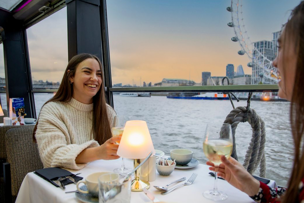 London Dinner Cruise on the River Thames - Embark on an unforgettable evening aboard a luxury dinner cruise along the River Thames. As London's iconic landmarks illuminate the night sky, enjoy a sumptuous four-course meal prepared with the finest ingredients. Sip on a welcome glass of sparkling wine as you glide past the London Eye, Tower Bridge, and the Houses of Parliament. Live entertainment enhances the ambiance, creating a romantic and memorable atmosphere. Whether celebrating a special occasion or seeking a unique night out, this cruise offers an exceptional dining experience with panoramic city views. Relax in elegant surroundings and let the city's charm captivate you. An evening of fine dining, live music, and breathtaking sights awaits on this premier Thames River cruise London Dinner Cruise on the River Thames - Image 4 of 5