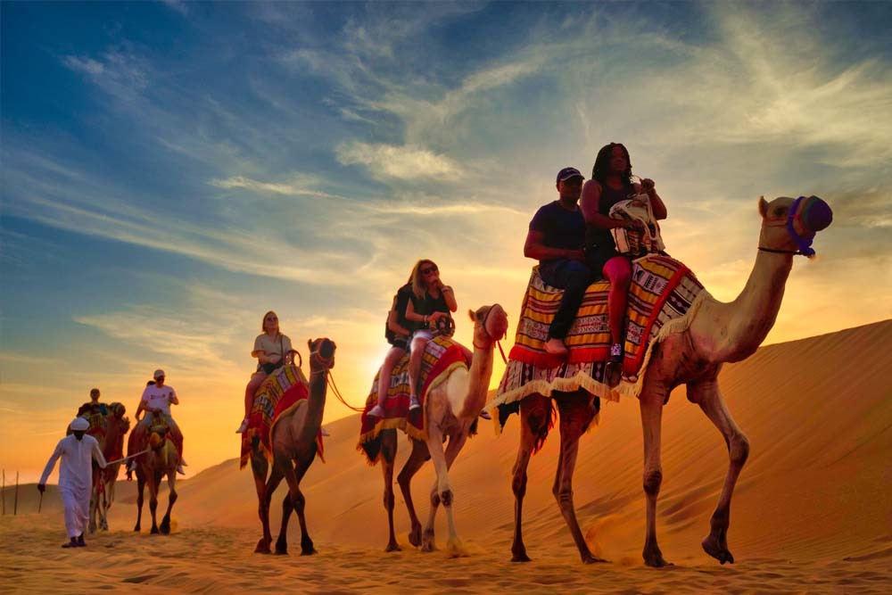 Premium Red Dunes, Camel Safari & 3 Cuisines Buffet At Al Khayma Camp - Your Trip to Dubai will not be fulfilled without exploring the magnificent activity to the Evening Desert Safari. This Fascinating tour starts from your destination (Hotel/Residence) around 3 pm on the Day by riding towards the Hajjar Mountains for the red dunes. Premium Red Dunes, Camel Safari & 3 Cuisines Buffet At Al Khayma Camp - Image 2 of 5