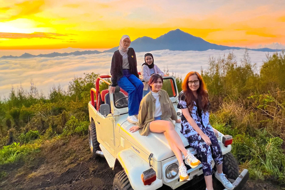 Mount Batur 4WD Jeep Tour Bali - Experience Bali's ultimate off road adventure with our Mount Batur 4WD Jeep Tour. Depart before dawn in a rugged 4WD jeep and navigate dramatic black lava fields and tropical jungle as you chase a breathtaking sunrise over Mount Batur’s crater lake. Enjoy expert local guides who share insights into Bali’s volcanic geology. After sunrise, savor an immersive Balinese breakfast with volcano views, then explore coffee plantations and authentic villages. With convenient hotel transfers, group sizes, and personalized service, our 4WD Mount Batur jeep tour offers an unforgettable blend of adrenaline, nature, culture. Book your adventure today and elevate your Bali experience. Mount Batur 4WD Jeep Tour Bali - Image 4 of 5