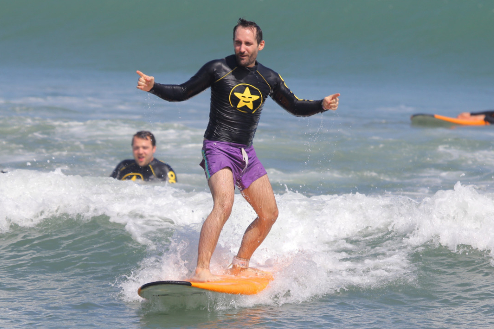 Surfing Lessons by Odysseys Surf School - Learn to surf on Bali’s iconic Kuta Beach with Odysseys Surf School. Join beginner-friendly Bali surf lessons and surf coaching led by AASI-certified instructors, with all equipment provided. Enjoy ocean safety instruction, surfboard hire, and free transfers from Kuta, Seminyak, Legian, Jimbaran, Sanur, and Nusa Dua. Book your Bali surf class, Kuta surf school experience, and discover Bali’s best surf spots today. Surfing Lessons by Odysseys Surf School - Image 2 of 5