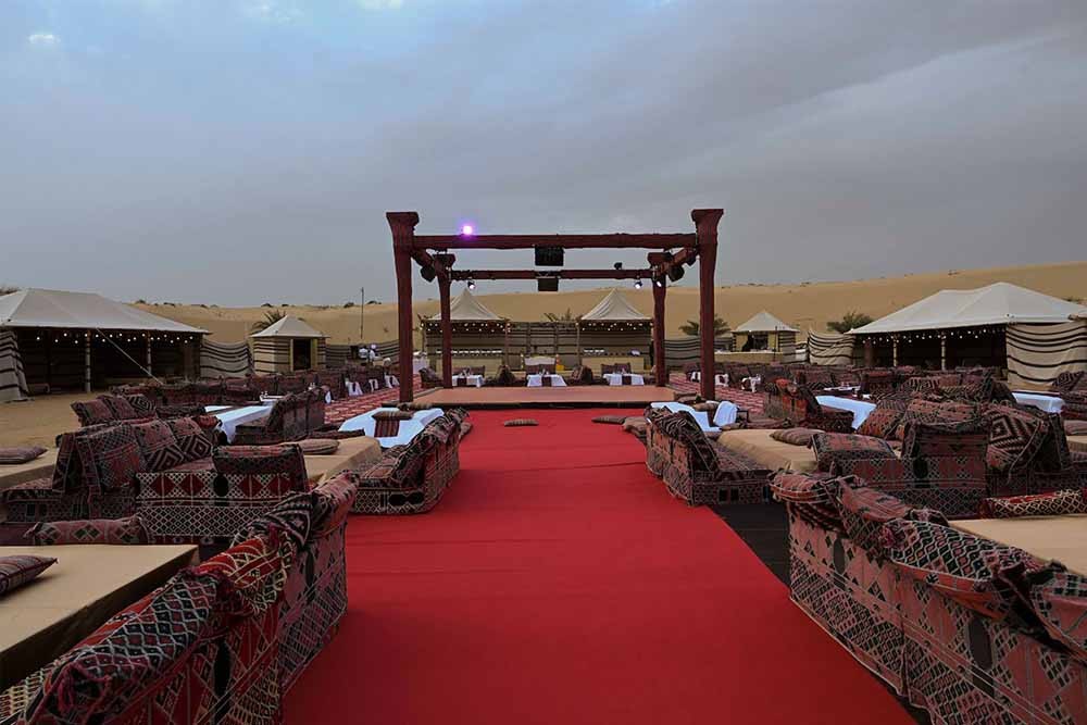 Caravanserai Desert Safari Dubai - We bring the VIP Desert Safari Dubai also known as the Caravan Safari. Learn about a fascinating part of regional history and see the stunning desert setting firsthand, with our incredible catered Dubai Caravan Safari. Our guests will be able to enjoy various different entertainment acts, many of which are traditional to the region, such as belly dancing, Tanura dancing, and a daring fire show. Sit down to a mouth-watering luxury banquet and enjoy the entertainment. Caravanserai Desert Safari Dubai - Image 2 of 5