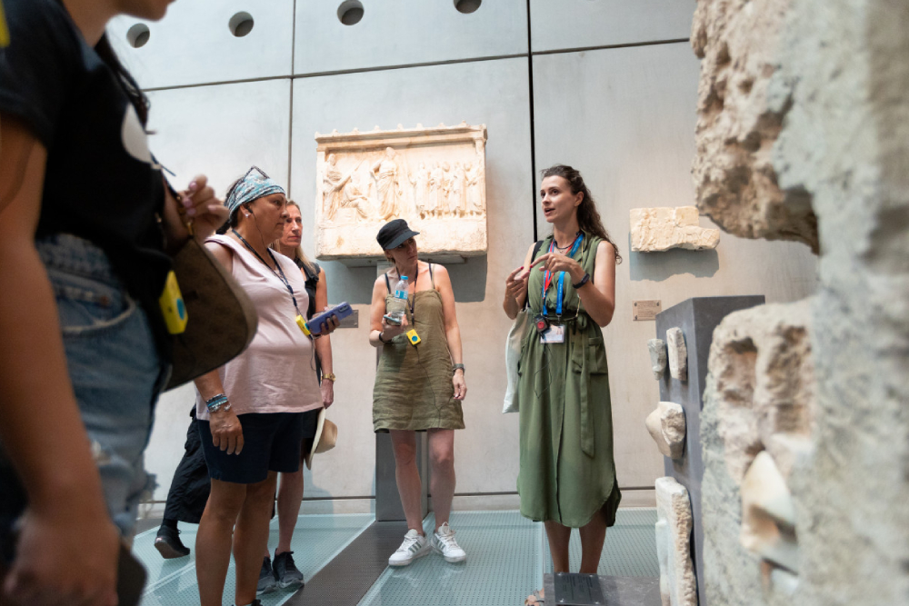 Acropolis Museum - Experience the Acropolis Museum with skip the line tickets and a multilingual audio guide on this top rated Athens museum tour. Wander through immersive ancient Greece exhibits, including Parthenon friezes, classical sculpture galleries, and live archaeological excavations beneath the glass floored Gallery of the Slopes. Discover Greek history, mythology, and religious practices on your self guided audio tour, with panoramic views of the Parthenon from the rooftop café. Perfect for Athens sightseeing, cultural tours, family activities, and history enthusiasts exploring the best attractions in Greece. Acropolis Museum - Image 4 of 5