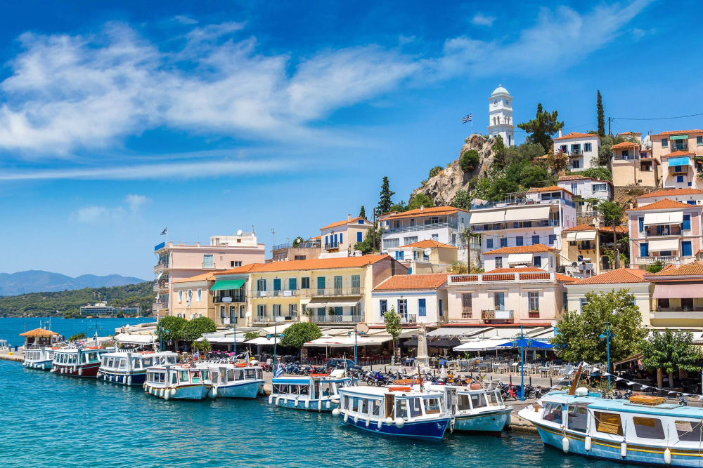 Saronic Islands Cruise Tour From Athens - Set sail on the Athens to Saronic Islands Cruise, a full day Greek island tour visiting Hydra, Poros, and Aegina. Enjoy scenic views, local culture, and island adventures. This relaxing cruise includes onboard lunch, entertainment, and guided tour options perfect for travelers looking to explore the best Greek islands near Athens in one day. Saronic Islands Cruise Tour From Athens - Image 1 of 5