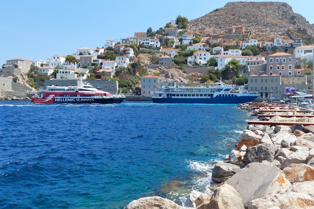 Saronic Islands Cruise Tour From Athens - Set sail on the Athens to Saronic Islands Cruise, a full day Greek island tour visiting Hydra, Poros, and Aegina. Enjoy scenic views, local culture, and island adventures. This relaxing cruise includes onboard lunch, entertainment, and guided tour options perfect for travelers looking to explore the best Greek islands near Athens in one day. Saronic Islands Cruise Tour From Athens - Image 3 of 5