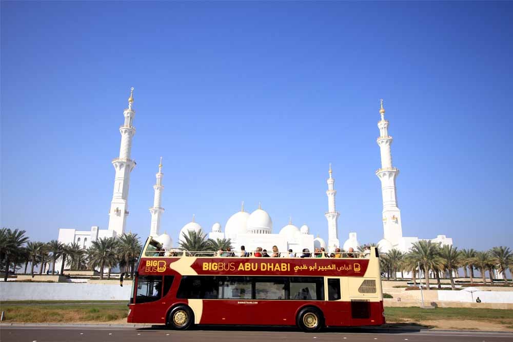 Big Bus Tour Abu Dhabi - Hop on-board the Big Bus Abu Dhabi to enjoy discovering and exploring the UAE Capital’s grand landmarks. The open-top double-decker bus provides fantastic views and a great atmosphere allowing you to enjoy Abu Dhabi’s charm. You will get to explore the majestic palaces, rich museums, historic sites, public beach, and old souks. Big Bus Tour Abu Dhabi - Image 1 of 5