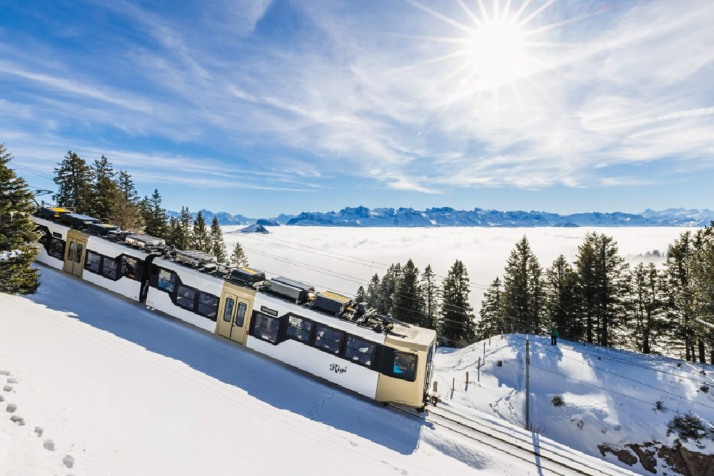 Mount Rigi Queen of the Mountains Ticket - Explore the beauty of Mount Rigi, known as the Queen of the Mountains, with an all-in-one ticket deal. Ride the historic cogwheel train, glide up via cable car, and take in panoramic views of the Swiss Alps. Ideal for day trips from Lucerne or Zurich year-round! Mount Rigi Queen of the Mountains Ticket - Image 1 of 5
