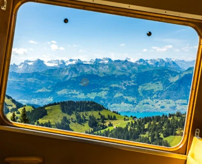 Mount Rigi Queen of the Mountains Ticket - Explore the beauty of Mount Rigi, known as the Queen of the Mountains, with an all-in-one ticket deal. Ride the historic cogwheel train, glide up via cable car, and take in panoramic views of the Swiss Alps. Ideal for day trips from Lucerne or Zurich year-round! Mount Rigi Queen of the Mountains Ticket - Image 2 of 5