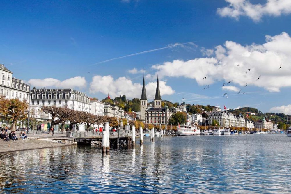 Lucerne City Tour and Yacht Cruise from Zurich Ticket - Book a Lucerne city tour and Lake Lucerne yacht cruise from Zurich. Enjoy a full day trip with guided sightseeing, free time to explore, a scenic boat ride, and visits to top attractions like the Chapel Bridge and Lion Monument. Lucerne City Tour and Yacht Cruise from Zurich Ticket - Image 1 of 5