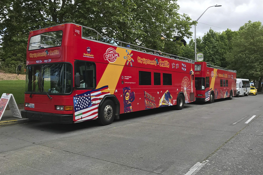 Seattle Hop-On Hop-Off Bus by City Sightseeing Ticket - Discover Seattle’s top attractions with the City Sightseeing Hop-On Hop-Off Bus Tour. Enjoy panoramic views from an open top bus, hop on and off at your favorite spots, and explore landmarks like Pike Place Market, Space Needle, and waterfront at your own pace. Perfect for first time visitors and locals alike. Seattle Hop-On Hop-Off Bus by City Sightseeing Ticket - Image 1 of 5
