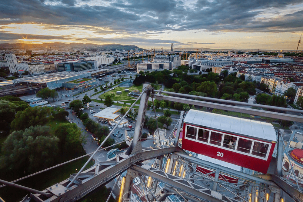 Vienna's Giant Ferris Wheel - Ride Vienna’s iconic Giant Ferris Wheel in the Prater park for breathtaking city views. Discover its rich history and book Wiener Riesenrad tickets online for a timeless experience. Vienna's Giant Ferris Wheel - Image 1 of 5