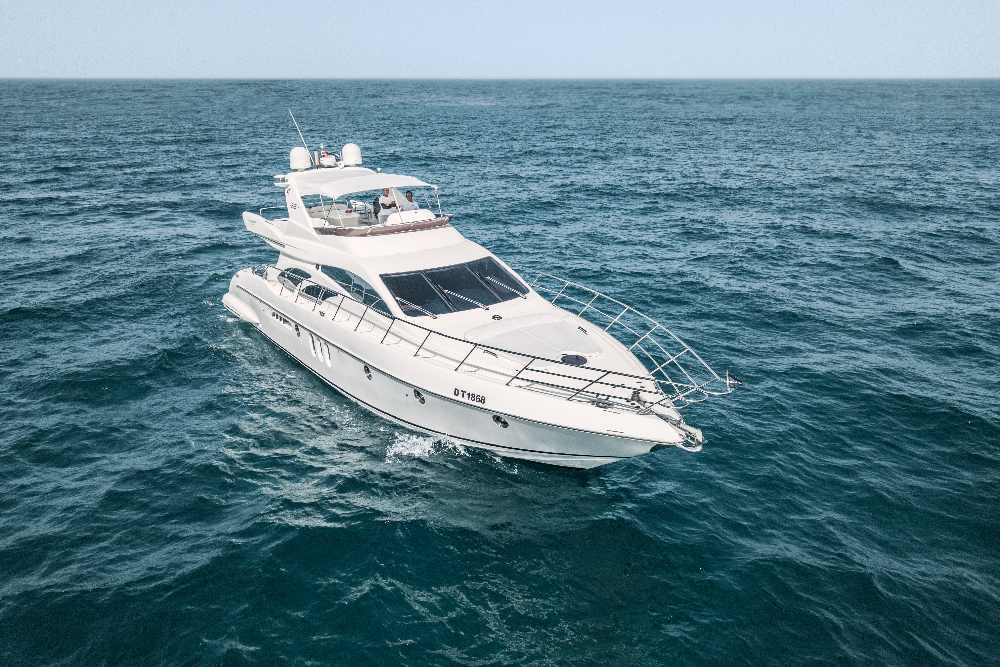 Luxury 62 Ft Yacht Ride Dubai Marina - Experience Luxury at every step with us. Come aboard our charter and experience the time of your life. Yacht Rental Dubai, yacht party. hire private luxury. This lavish Dubai Yacht starts from Dubai Marina Yacht Club. Explore the major landmarks like Palm Jumeirah Island, Atlantis the palm, Burj Al Arab, blue water, skyline, and beautiful private beaches. Luxury 62 Ft Yacht Ride Dubai Marina - Image 1 of 5