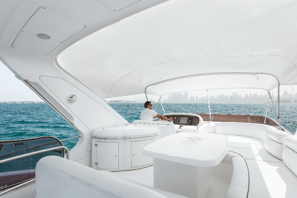 Luxury 62 Ft Yacht Ride Dubai Marina - Experience Luxury at every step with us. Come aboard our charter and experience the time of your life. Yacht Rental Dubai, yacht party. hire private luxury. This lavish Dubai Yacht starts from Dubai Marina Yacht Club. Explore the major landmarks like Palm Jumeirah Island, Atlantis the palm, Burj Al Arab, blue water, skyline, and beautiful private beaches. Luxury 62 Ft Yacht Ride Dubai Marina - Image 5 of 5
