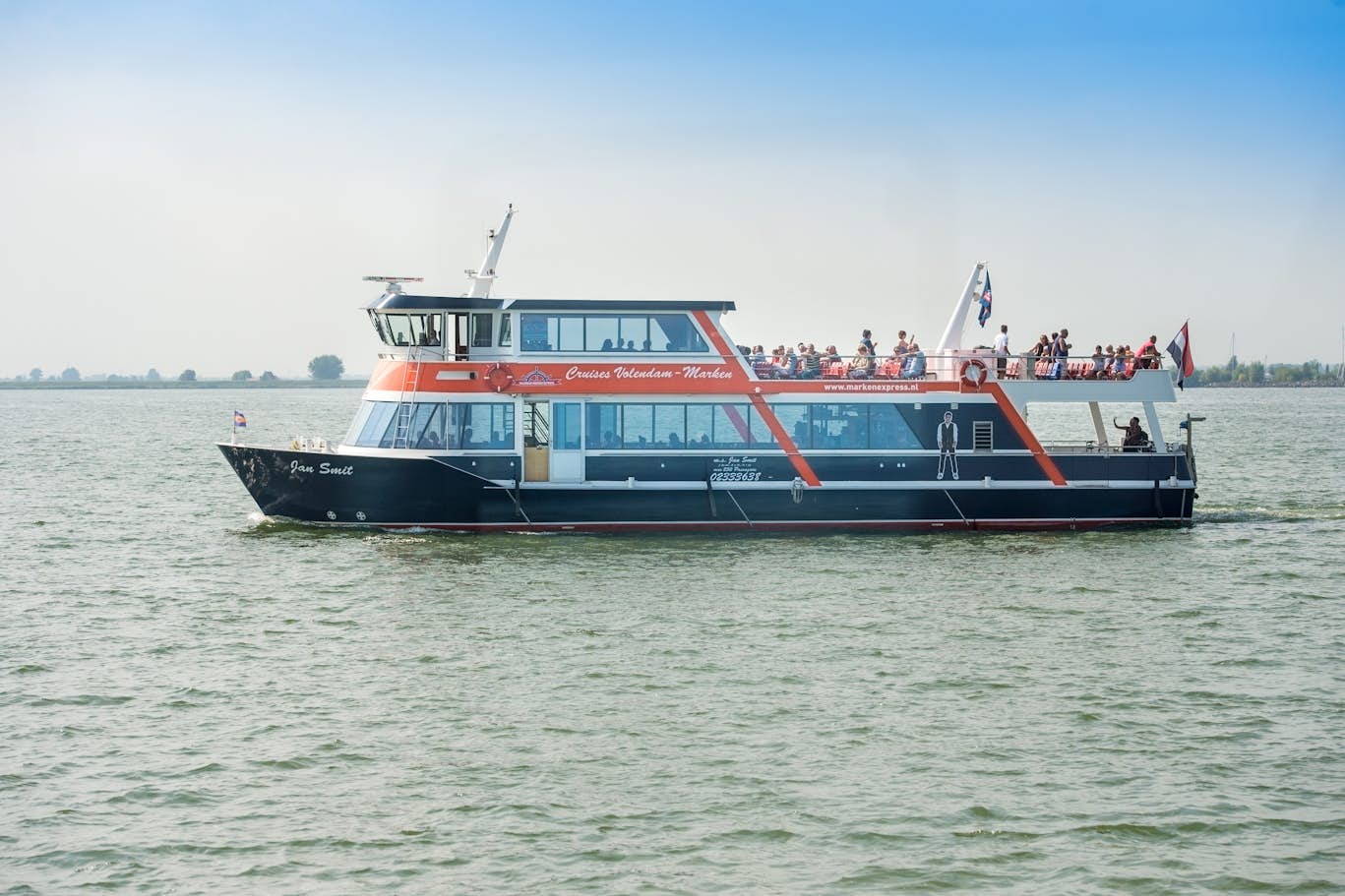 Volendam Marken Express Ferry Ticket - Ride the Volendam–Marken Express ferry every 45 minutes between Volendam (Haven 39) and Marken (Havenbuurt 19), and enjoy an audio guide in 16 languages for a scenic, informative trip across Gouwzee Lake. Volendam Marken Express Ferry Ticket - Image 1 of 5