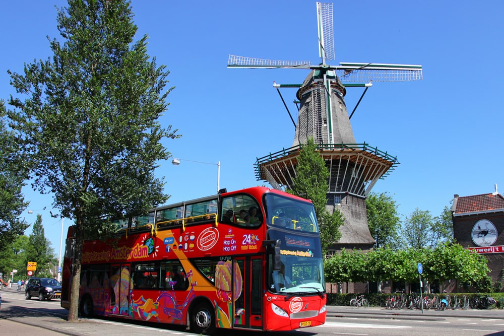 City Sightseeing Amsterdam Hop-on Hop-off Bus Tour - Explore Amsterdam with a flexible City Sightseeing hop-on hop-off bus and boat tour. Stop at Central Station, PTA, the National Maritime Museum, Gassan Diamonds, Heineken Experience, Museum District, Leidseplein, Jordaan and more along a scenic city route. City Sightseeing Amsterdam Hop-on Hop-off Bus Tour - Image 1 of 5