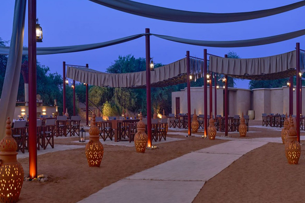 The Nomad Garden: A premium desert & dining experience - Experience The Nomad Garden Dubai, a premium desert dining experience by Arabian Adventures in the Dubai Desert Conservation Reserve. Enjoy a sunset stop, Bedouin‑inspired cuisine by JW Marriott Marquis Dubai, live entertainment, and a luxury desert safari with private seating. The Nomad Garden: A premium desert & dining experience - Image 1 of 5