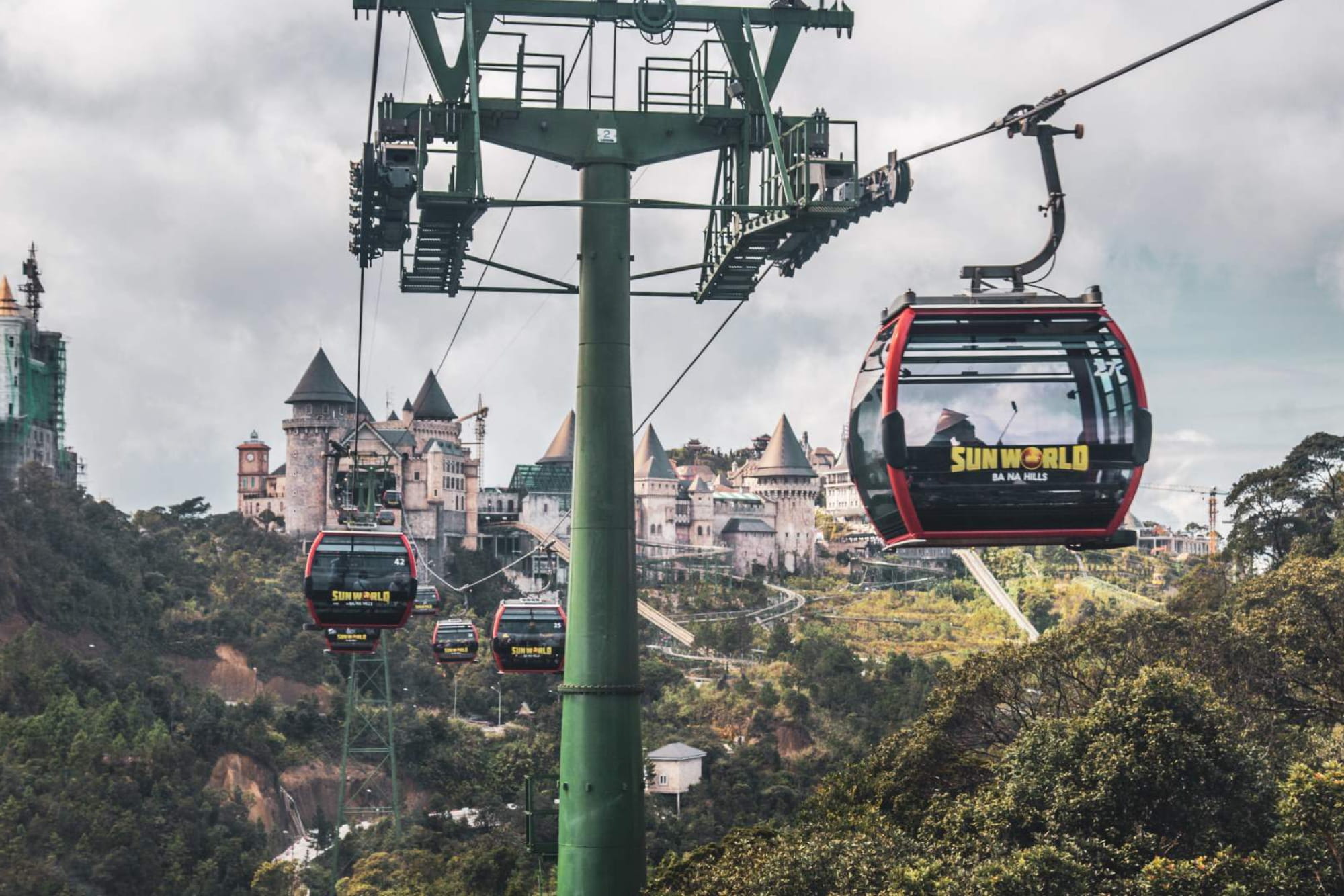Sun World Ba Na Hills with Cable Car & Buffet Experience - Book Sun World Ba Na Hills: cable car rides, Golden Bridge, French Village, gardens & Fantasy Park entry, plus Four Seasons buffet and voucher perks. Sun World Ba Na Hills with Cable Car & Buffet Experience - Image 3 of 5