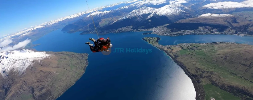 Skydive Queenstown Experience by NZONE - Experience thrilling tandem skydiving in Queenstown from 9,000 to 15,000 ft. Enjoy up to 60 seconds of free fall at 200 km/h with stunning Lake Wakatipu views. Safe, professional, and unforgettable. Skydive Queenstown Experience by NZONE - Image 3 of 5