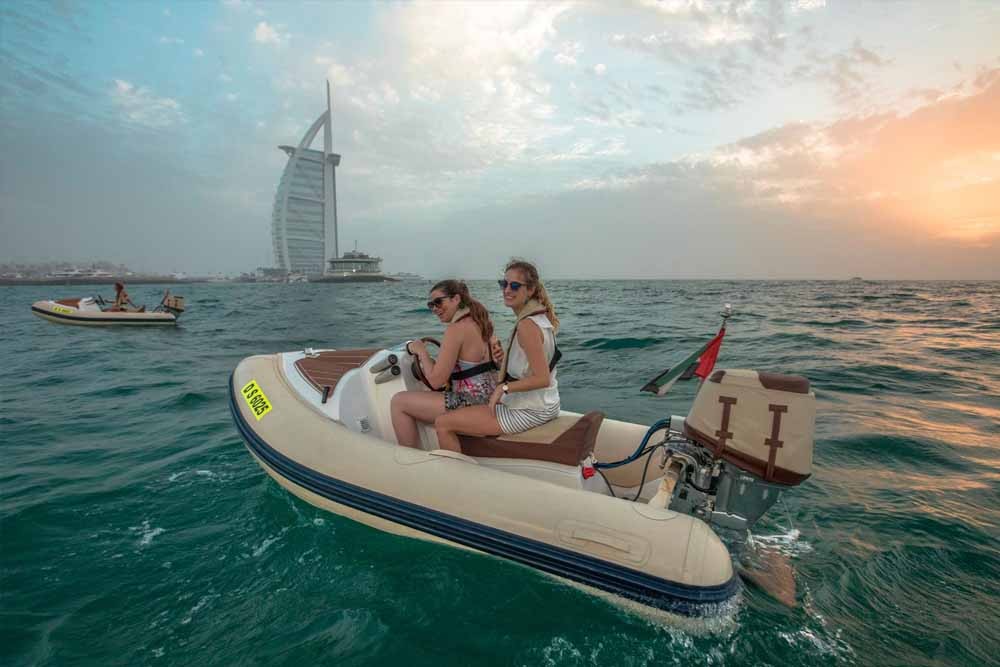 Dubai Sunset Hero Boat Tour - Explore the incredible artificial archipelago of various small islands constructed in the rough shape of a world map known as The World Islands. Enjoy a spectacular sunset view over the water before returning to the marina for freshly grilled Arabian prawns and sparkling date juice. Dubai Sunset Hero Boat Tour - Image 1 of 5