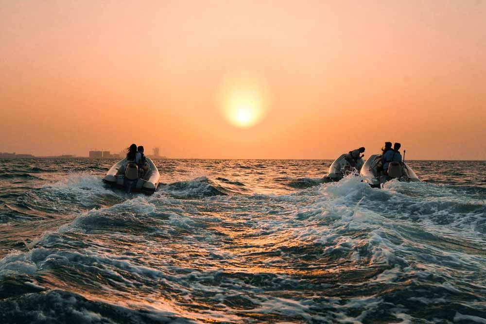 Dubai Sunset Hero Boat Tour - Explore the incredible artificial archipelago of various small islands constructed in the rough shape of a world map known as The World Islands. Enjoy a spectacular sunset view over the water before returning to the marina for freshly grilled Arabian prawns and sparkling date juice. Dubai Sunset Hero Boat Tour - Image 2 of 5