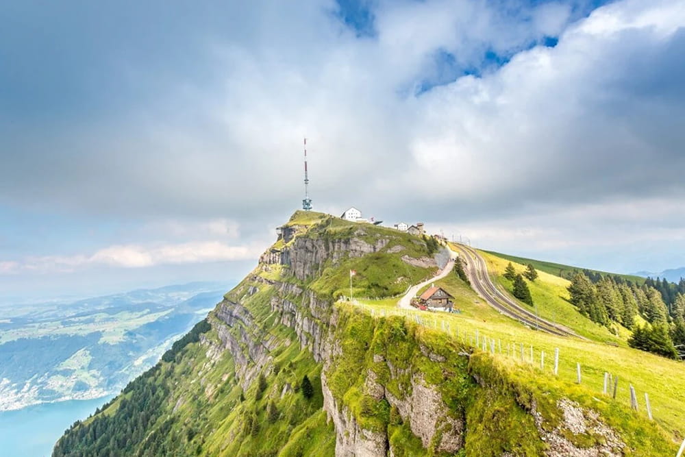 Mt. Rigi Day Tour with Cable Car, Cogwheel Train and Boat Cruise - Enjoy a scenic Mt. Rigi day tour from Zurich with cable car, cogwheel train, and Lake Lucerne boat cruise. Discover Lucerne Old Town, stunning Alpine views, and top Swiss attractions on this unforgettable full‑day trip. Mt. Rigi Day Tour with Cable Car, Cogwheel Train and Boat Cruise - Image 1 of 5