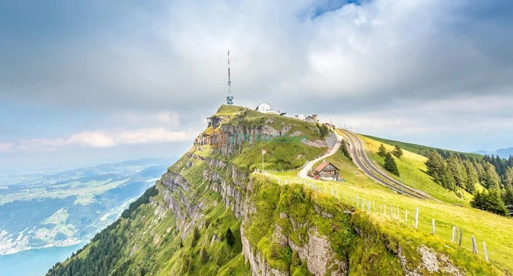 Mt. Rigi Day Tour with Cable Car, Cogwheel Train and Boat Cruise - Enjoy a scenic Mt. Rigi day tour from Zurich with cable car, cogwheel train, and Lake Lucerne boat cruise. Discover Lucerne Old Town, stunning Alpine views, and top Swiss attractions on this unforgettable full‑day trip. Mt. Rigi Day Tour with Cable Car, Cogwheel Train and Boat Cruise - Image 1 of 5