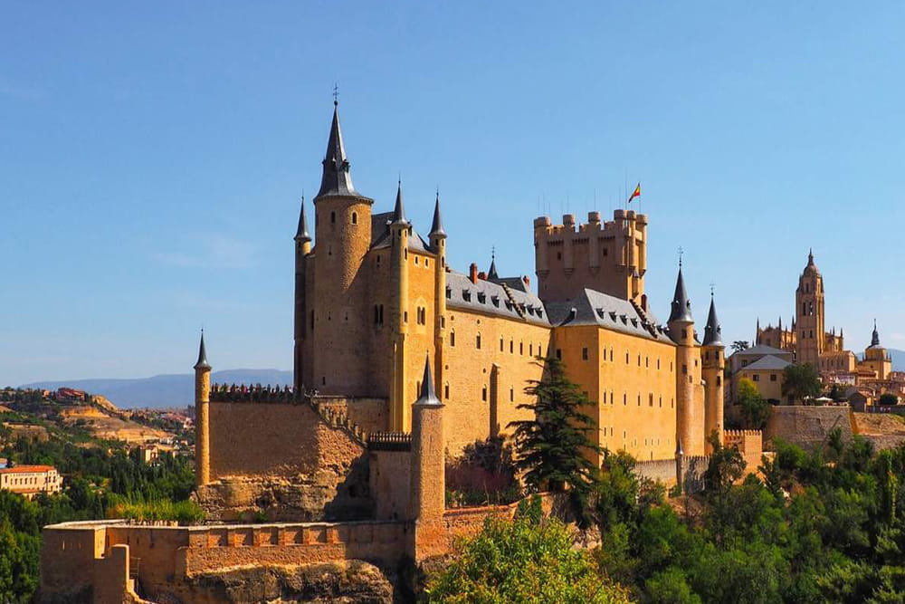 Avila Walls and Segovia Guided Tour - Discover Ávila and Segovia on a full-day tour from Madrid. Explore medieval walls, the Roman Aqueduct, and the Alcázar with a guided experience and stunning UNESCO sites. Avila Walls and Segovia Guided Tour - Image 1 of 5
