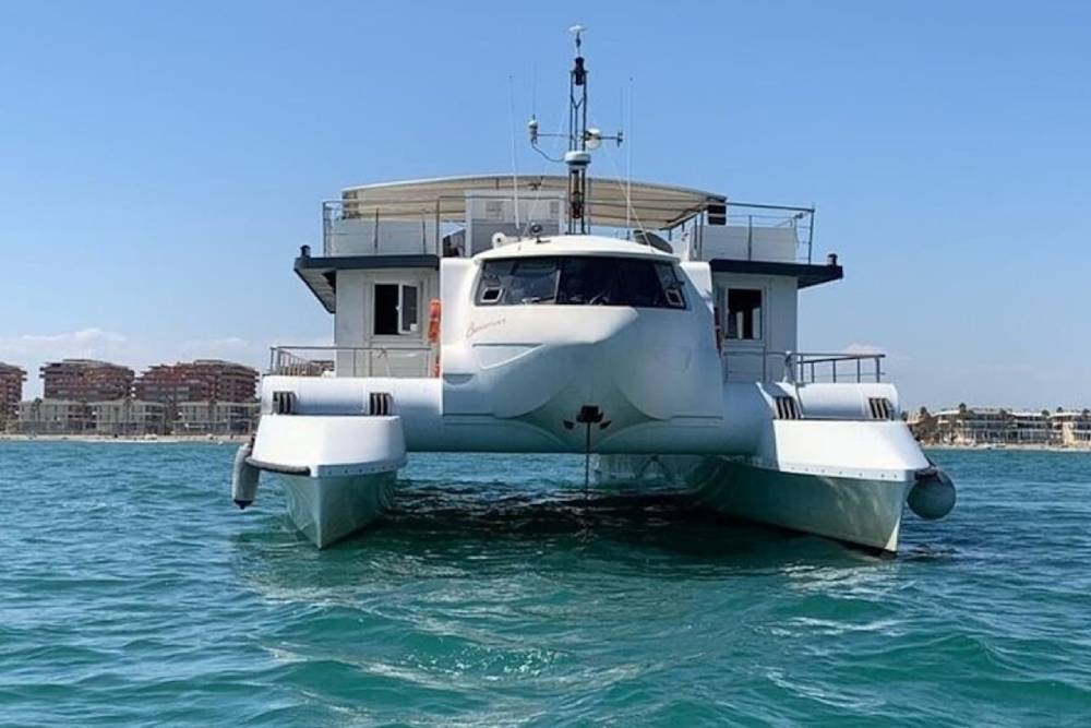 Valencia: Marina Catamaran Cruise - Enjoy a relaxing catamaran cruise from Valencia Marina with a welcome drink, scenic coastal views, and comfortable onboard facilities for a perfect sailing experience. Valencia: Marina Catamaran Cruise - Image 3 of 5