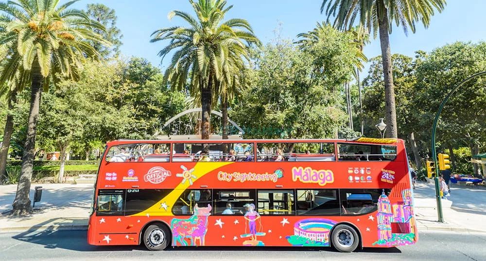 City Sightseeing Malaga Hop-on Hop-off Bus Tour - Explore top attractions with the Málaga 24-hour hop-on hop-off bus tour. Enjoy flexible travel, panoramic city views, and multilingual audio commentary across 14 key stops. City Sightseeing Malaga Hop-on Hop-off Bus Tour - Image 1 of 5