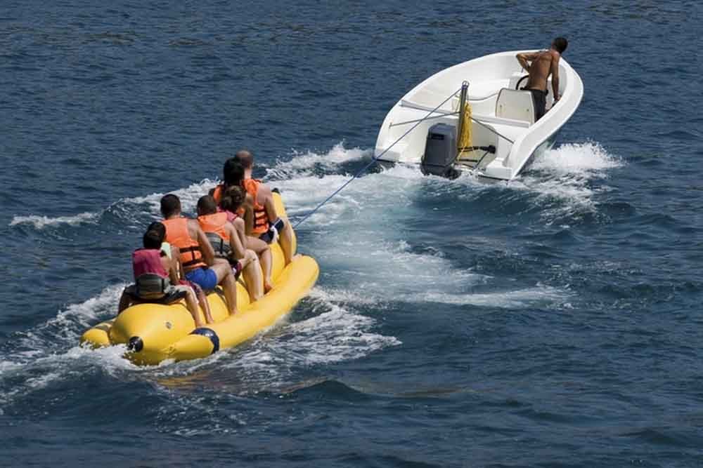 Banana Boat Ride Dubai - Banana ride makes you feel the vibe of a riding a stream ski. Most people who pick Banana Vessel ride are adrenaline searchers who have an excursion with family or gathering of friends, as it can oblige gathering of individuals without a moment's delay. Banana pontoon ride is a standout amongst the most usually attempted water exercises on the shorelines in Dubai. Banana Boat Ride Dubai - Image 4 of 5