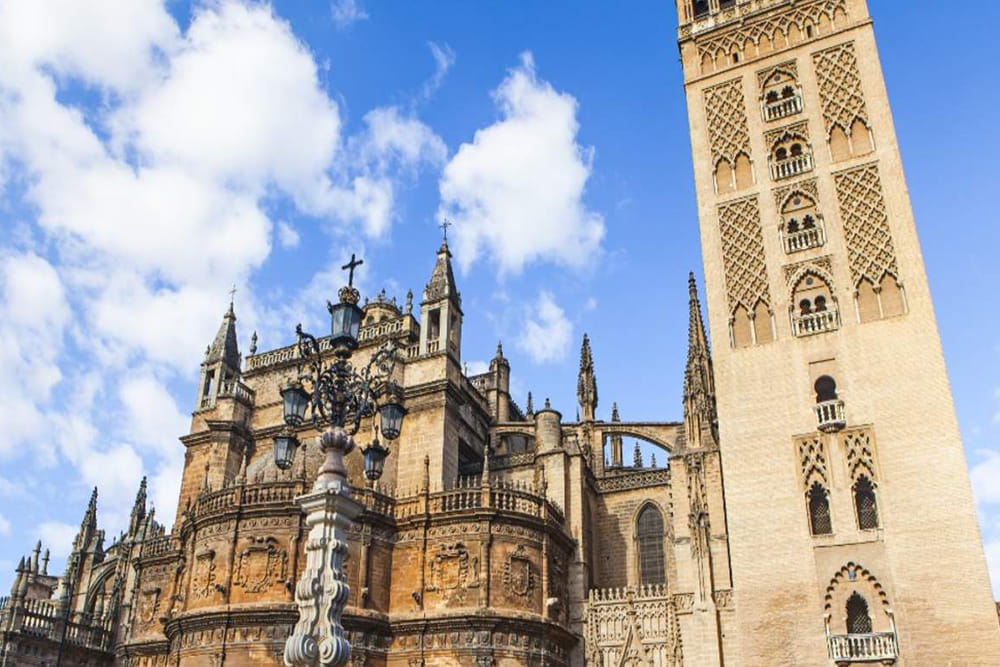 Cathedral, Alcazar, and Giralda guided tour in Seville - Explore Seville’s top attractions with a guided tour of the Royal Alcázar, Seville Cathedral, and Giralda Tower. Discover UNESCO heritage sites, Game of Thrones filming locations, Gothic architecture, and Spanish history with expert bilingual guides. Cathedral, Alcazar, and Giralda guided tour in Seville - Image 2 of 5