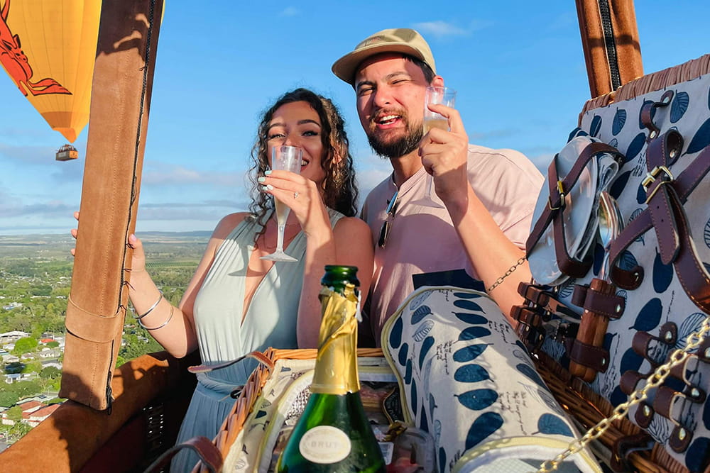 Private Hot Air Balloon Experience in Cairns and Port Douglas - Enjoy a private hot air balloon ride in Cairns with sunrise views over the Atherton Tablelands, breakfast at Palm Cove, and hotel transfers included. Private Hot Air Balloon Experience in Cairns and Port Douglas - Image 1 of 5