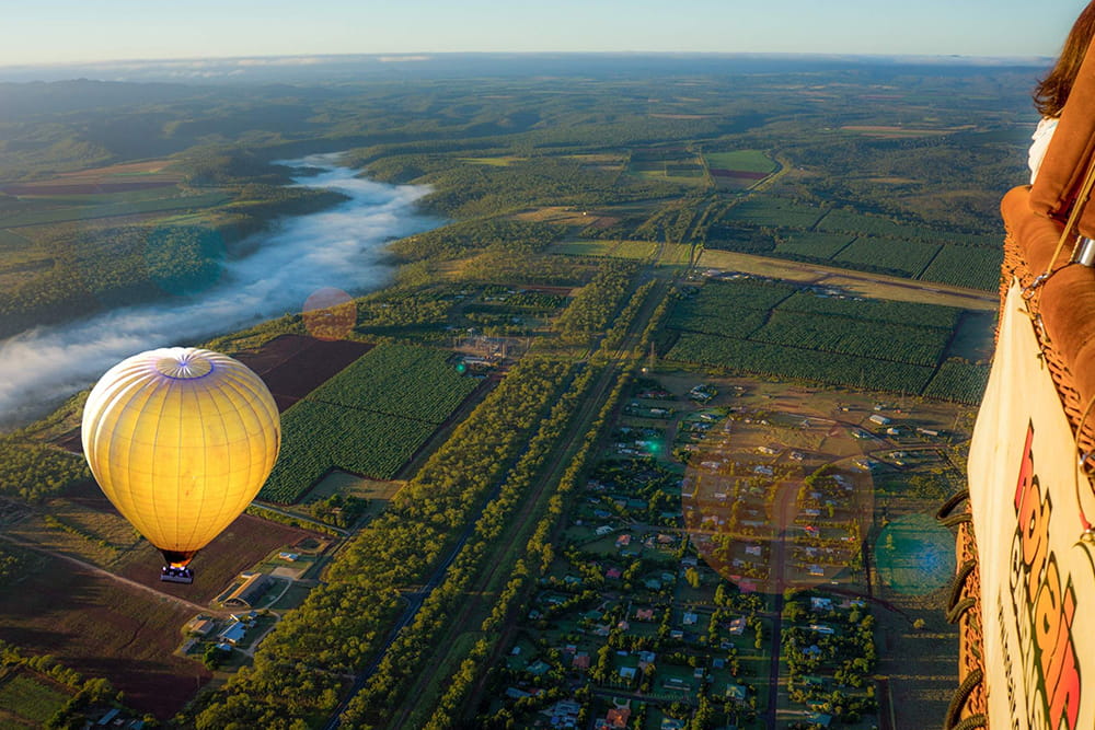 Private Hot Air Balloon Experience in Cairns and Port Douglas - Enjoy a private hot air balloon ride in Cairns with sunrise views over the Atherton Tablelands, breakfast at Palm Cove, and hotel transfers included. Private Hot Air Balloon Experience in Cairns and Port Douglas - Image 5 of 5