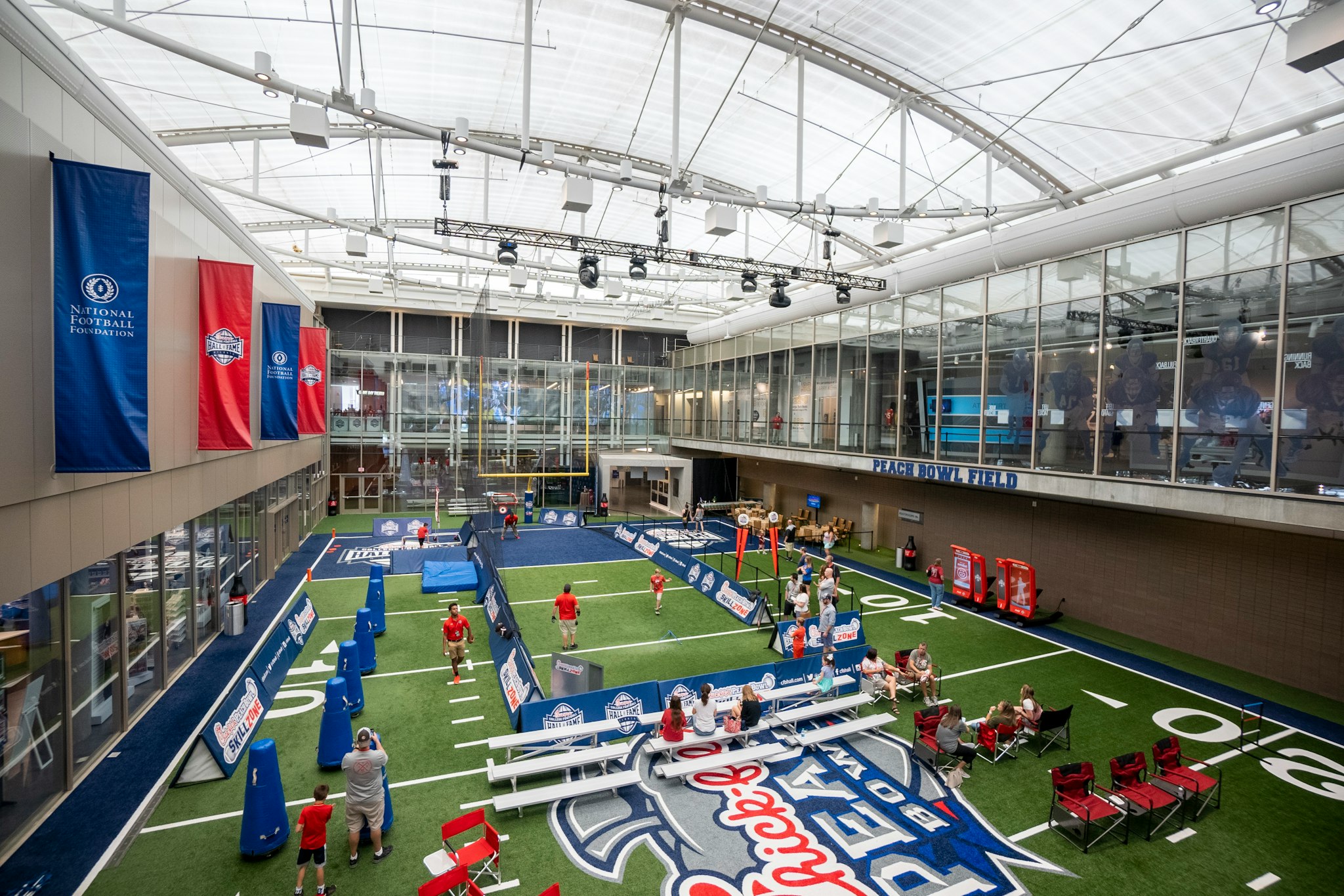 College Football Hall of Fame - Explore interactive exhibits, memorabilia, and a 45-yard indoor football field at the College Football Hall of Fame in Atlanta. College Football Hall of Fame - Image 1 of 5