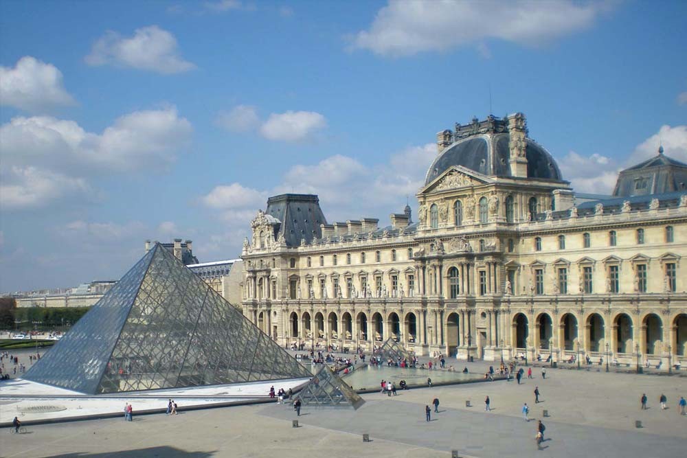 Louvre Museum Paris - A visit to Paris would be incomplete without a trip to the Louvre. The Louvre, originally a royal palace but now the world's most famous museum is a must-visit for anyone with a slight interest in art. Some of the museum's most celebrated works of art include the Mona Lisa and the Venus of Milo. Louvre Museum Paris - Image 2 of 5