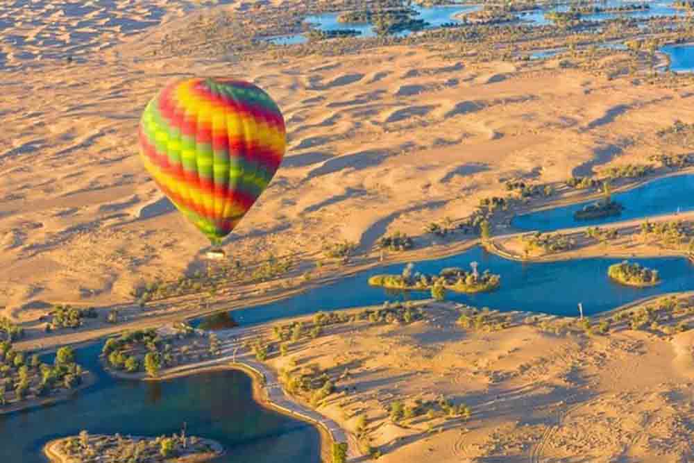 Dubai Hot Air Balloon Experience - Discover Dubai's majesty from above with our thrilling hot air balloon rides Dubai. Float over iconic landmarks and desert vistas for an unforgettable experience. Choose from specially curated packages for an adventure that combines tranquility and exhilaration." Dubai Hot Air Balloon Experience - Image 1 of 5