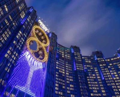 Golden Reel Ferris Wheel Macau - Experience the Golden Reel Ferris Wheel Macau, an iconic 8-shaped attraction at Studio City. Enjoy breathtaking views of Macau from 130 meters above the ground. Perfect for families, couples, and friends, the Golden Reel Ferris Wheel Macau offers a unique ride experience day or night. Plan your visit now and make unforgettable memories. Golden Reel Ferris Wheel Macau - Image 2 of 5