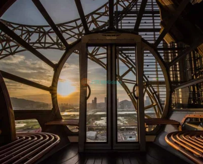 Golden Reel Ferris Wheel Macau - Experience the Golden Reel Ferris Wheel Macau, an iconic 8-shaped attraction at Studio City. Enjoy breathtaking views of Macau from 130 meters above the ground. Perfect for families, couples, and friends, the Golden Reel Ferris Wheel Macau offers a unique ride experience day or night. Plan your visit now and make unforgettable memories. Golden Reel Ferris Wheel Macau - Image 5 of 5
