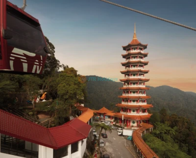 Genting Highlands Premium Outlets Cable Car - Experience the Genting Highlands Premium Outlets Cable Car, a scenic gondola ride offering breathtaking views of mountains and lush landscapes. Start your journey at Awana Station and ascend to SkyAvenue Station at the peak. Stop midway to explore Chin Swee Caves Temple and its serene surroundings. Upgrade your Genting Highlands Premium Outlets Cable Car experience with a glass floor gondola for added excitement. Perfect for families and adventure seekers, the Genting Highlands Premium Outlets Cable Car promises an unforgettable journey to the top! Genting Highlands Premium Outlets Cable Car - Image 2 of 5