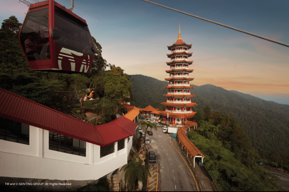 Genting Highlands Premium Outlets Cable Car - Experience the Genting Highlands Premium Outlets Cable Car, a scenic gondola ride offering breathtaking views of mountains and lush landscapes. Start your journey at Awana Station and ascend to SkyAvenue Station at the peak. Stop midway to explore Chin Swee Caves Temple and its serene surroundings. Upgrade your Genting Highlands Premium Outlets Cable Car experience with a glass floor gondola for added excitement. Perfect for families and adventure seekers, the Genting Highlands Premium Outlets Cable Car promises an unforgettable journey to the top! Genting Highlands Premium Outlets Cable Car - Image 2 of 5