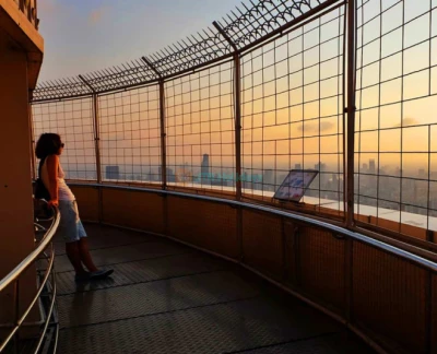 Baiyoke Observation Deck - Discover the breathtaking views from the Baiyoke Sky Hotel Observation Deck, one of Bangkok’s must-visit attractions. Experience panoramic sights from the 77th floor and the revolving viewpoint on the 84th floor. The Baiyoke Sky Hotel Observation Deck offers stunning 360-degree views of the city and beyond. Don’t miss the chance to enjoy a complimentary drink at the Roof Top Bar on the 83rd floor while exploring the Baiyoke Sky Hotel Observation Deck. Perfect for photography and unforgettable moments! Baiyoke Observation Deck - Image 2 of 5