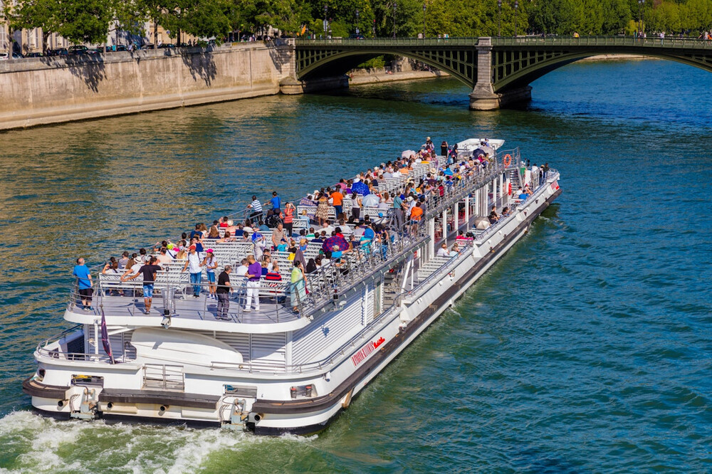 Seine River Cruise by Bateaux Mouches - Experience the beauty of Paris with the Seine River Cruise by Bateaux Mouches. The Seine River Cruise by Bateaux Mouches offers stunning views of iconic landmarks like the Eiffel Tower, Notre-Dame Cathedral, and the Louvre. As you sail along the Seine River, enjoy informative commentary that brings Paris’s history to life. The Seine River Cruise by Bateaux Mouches lets you see the city from a unique perspective, offering a peaceful and unforgettable experience. Don’t miss out on the Seine River Cruise by Bateaux Mouches for a perfect way to explore Paris! Seine River Cruise by Bateaux Mouches - Image 5 of 5