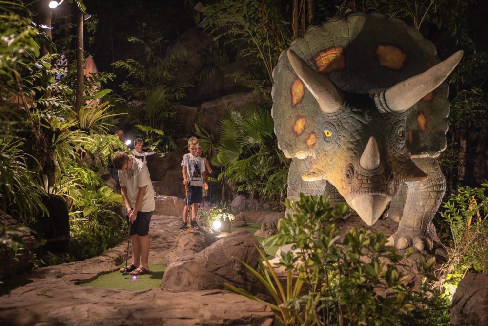Dino Park Mini Golf - Experience the ultimate prehistoric adventure at Dino Park Mini Golf in Phuket! Dino Park Mini Golf offers 18 fun-filled holes surrounded by life-sized dinosaurs, erupting volcanoes, and lush jungle scenery. Snap photos with giant dinosaur statues and enjoy a unique mini-golf experience like no other. Dino Park Mini Golf is perfect for families, friends, and adventure seekers looking for a fun activity in Phuket. Don’t miss the chance to play, explore, and create unforgettable memories at Dino Park Mini Golf! Dino Park Mini Golf - Image 4 of 5