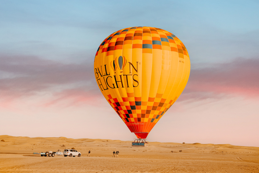 Sunrise Hot Air Balloon Flight - Experience the magic of a sunrise hot air balloon flight, soaring over stunning landscapes as the sun rises. Enjoy breathtaking views, peaceful moments, and unforgettable memories on this unique adventure. Sunrise Hot Air Balloon Flight - Image 1 of 5