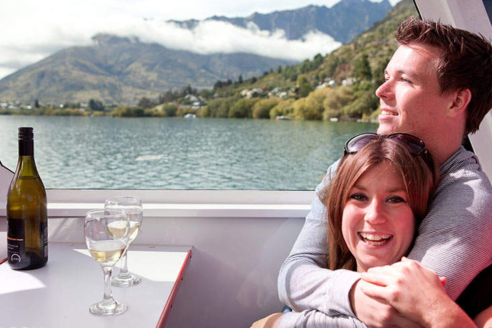 Ultimate Lake Wakatipu Cruise - Queenstown - Embark on the Ultimate Lake Wakatipu Cruise for a scenic journey through Queenstown's stunning landscapes. Sail past picturesque lakeside homes, the historic dam, and serene willow islands while enjoying breathtaking views. Experience expert commentary sharing local history and intriguing stories. The onboard bar offers drinks, making it the perfect way to relax and enjoy the beauty of the lake. Ultimate Lake Wakatipu Cruise - Queenstown - Image 5 of 5