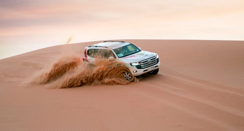 Morning Desert Safari Abu Dhabi - Experience the excitement of a 4x4 dune bashing adventure in Al Khatim Desert, Abu Dhabi. Join our Morning Desert Safari for camel rides, sandboarding, and refreshing campsite moments. Book now for an unforgettable desert experience. Morning Desert Safari Abu Dhabi - Image 1 of 5